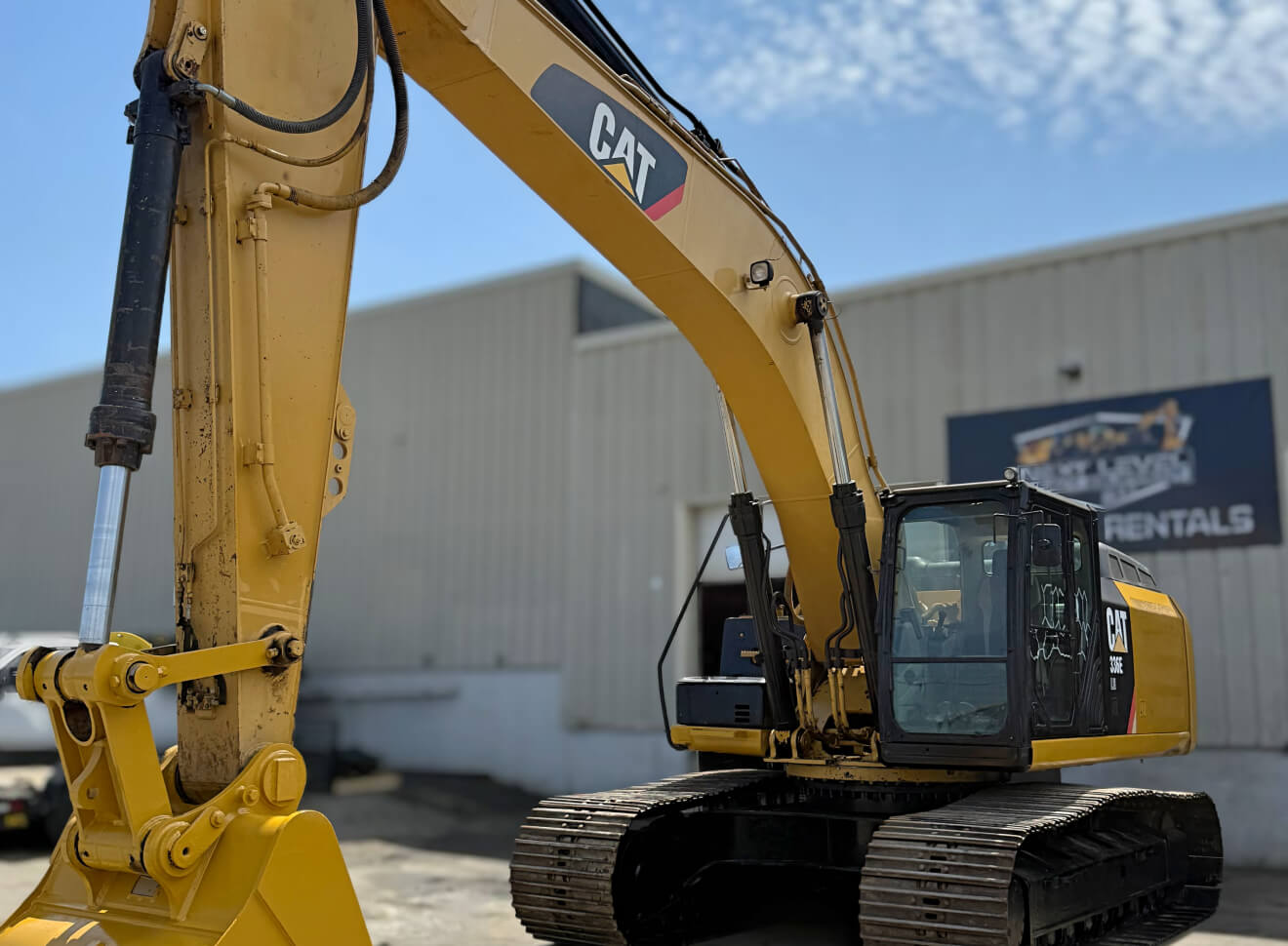 CAT excavator in parking lot